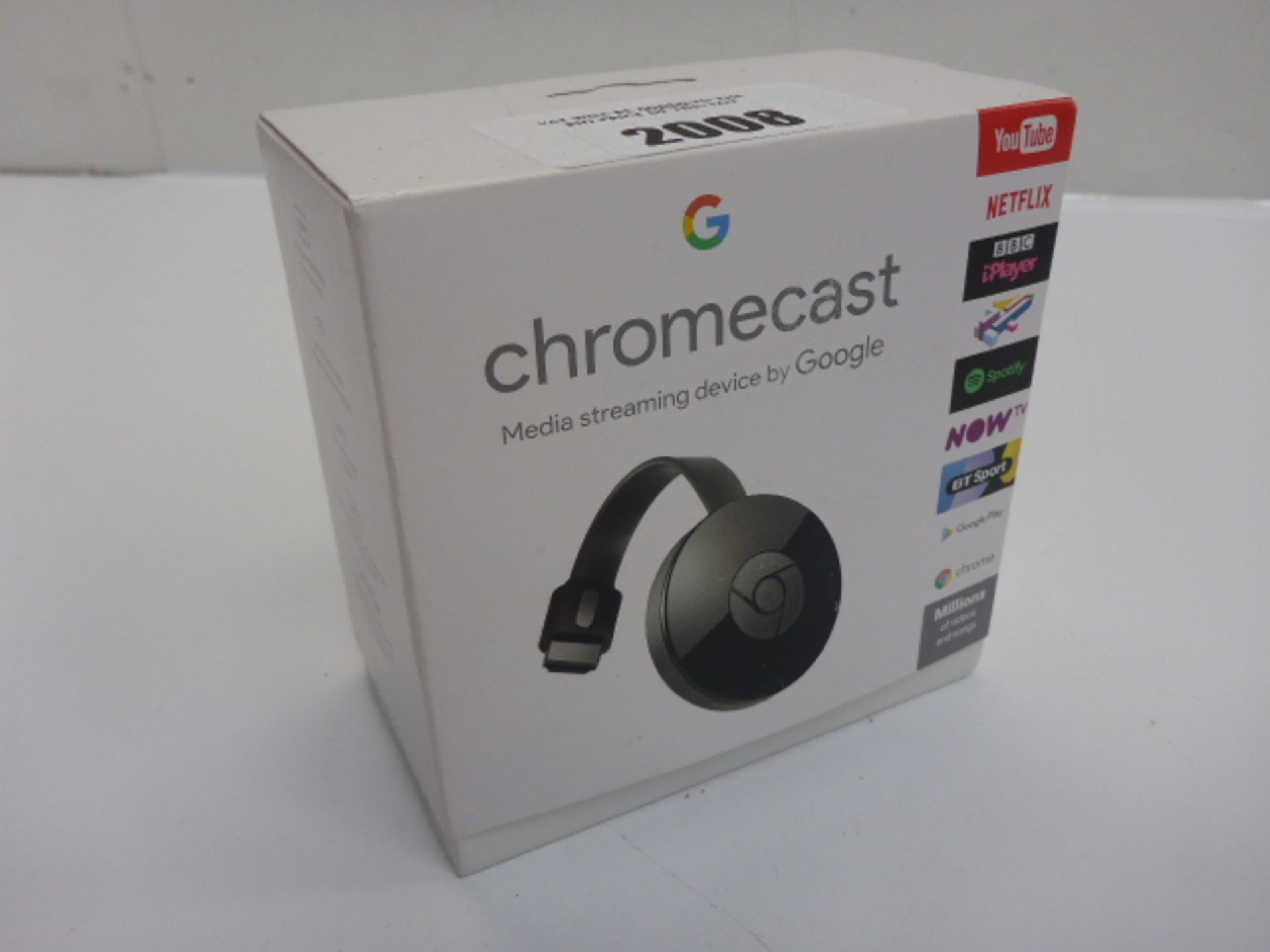 Google Chromecast media streaming device boxed.