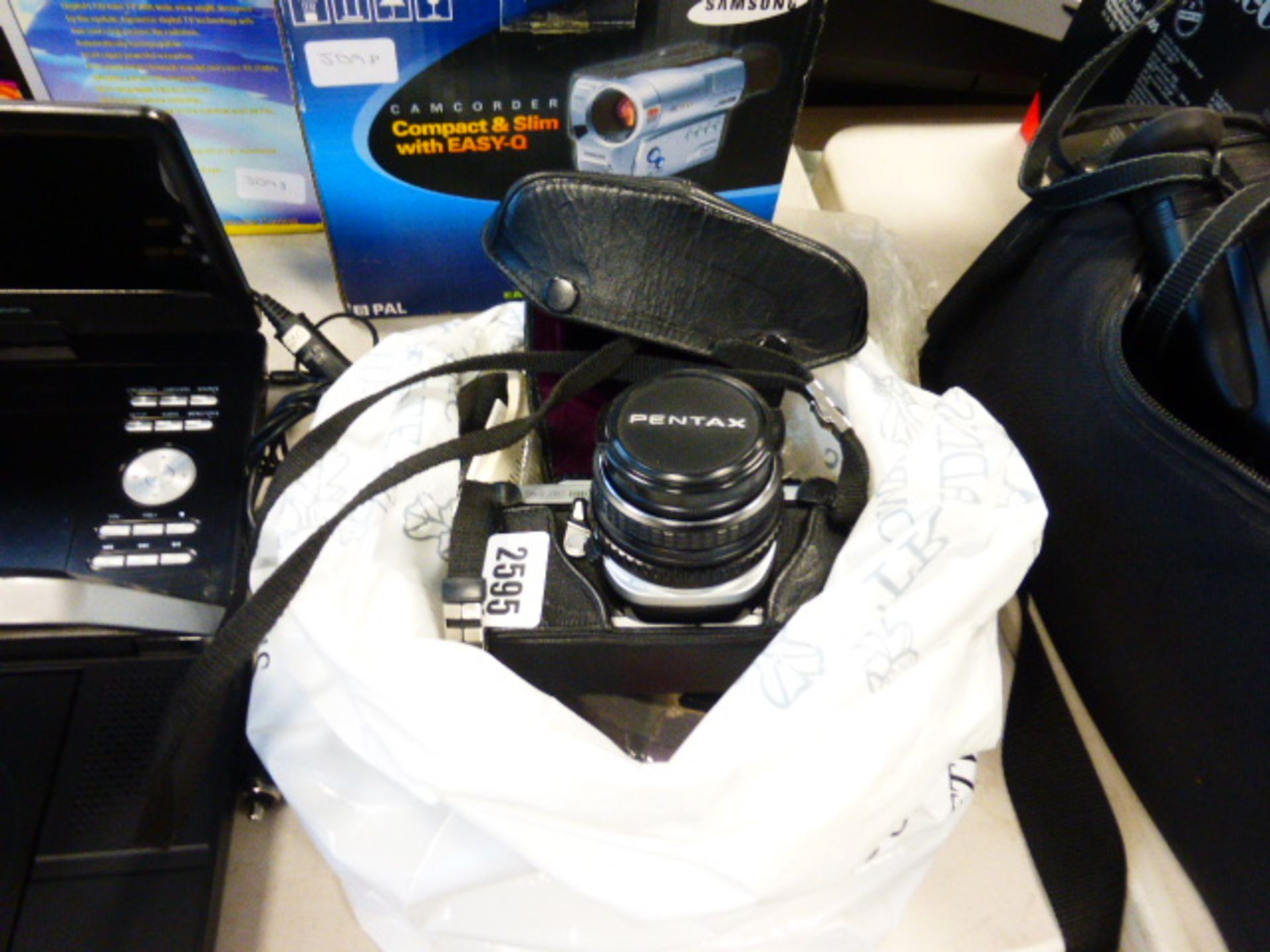 Pentax ME super film camera with accessories in bag