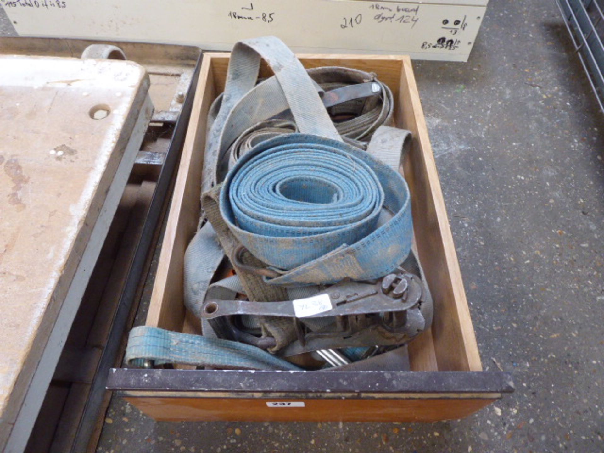 Tray containing ratchet tie down straps