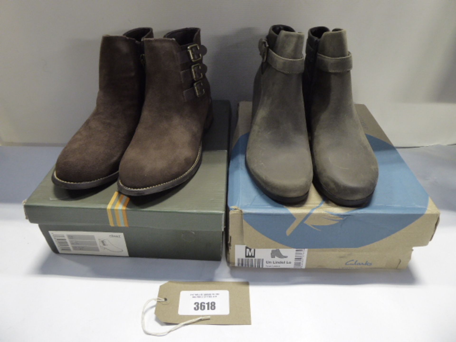 A pair of Clarks Unstructured Un Lindel taupe leather ankle boots UK 6 and a paitr of Divaz brown
