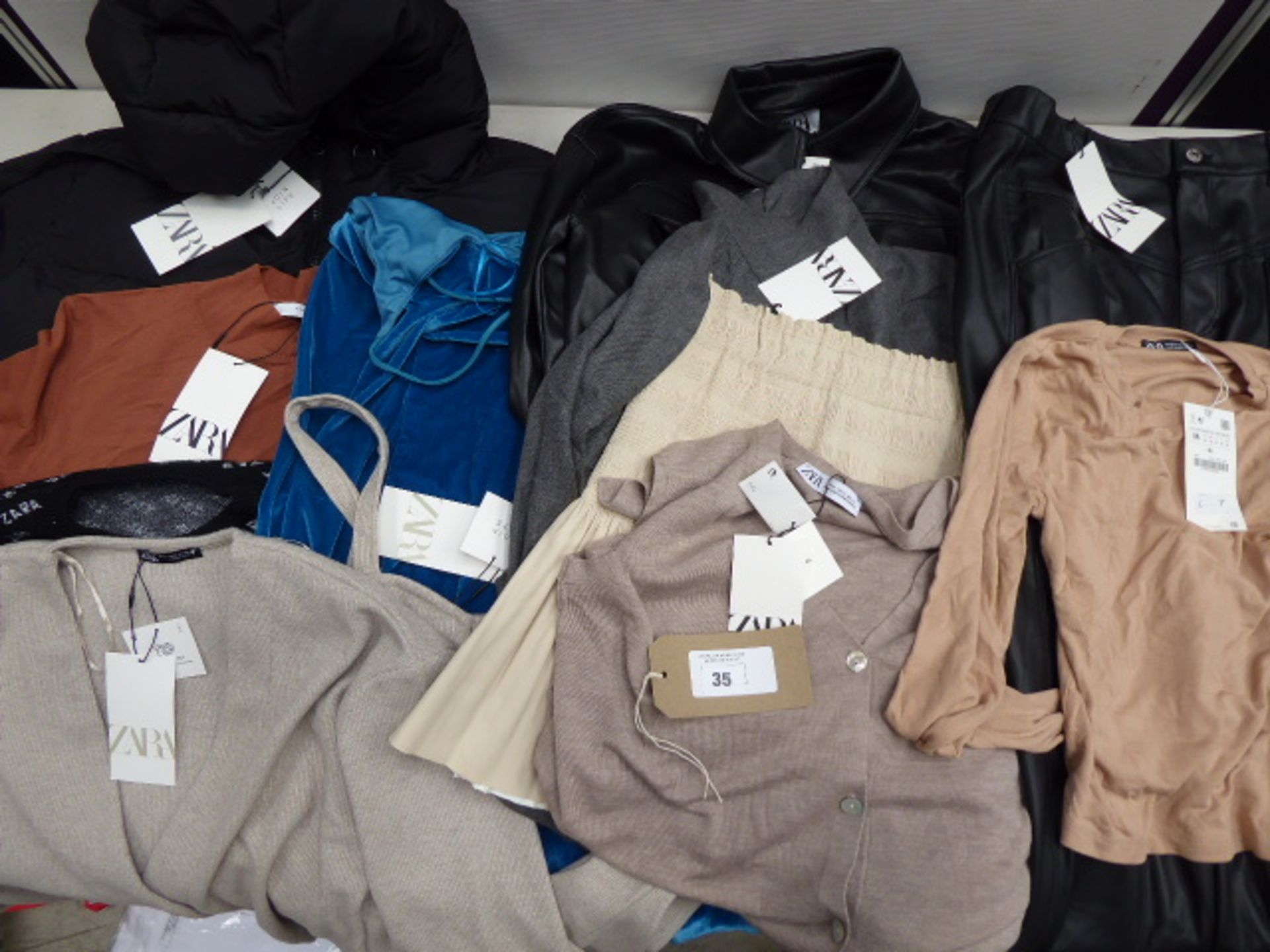 Twelve pieces of Zara clothing in various sizes