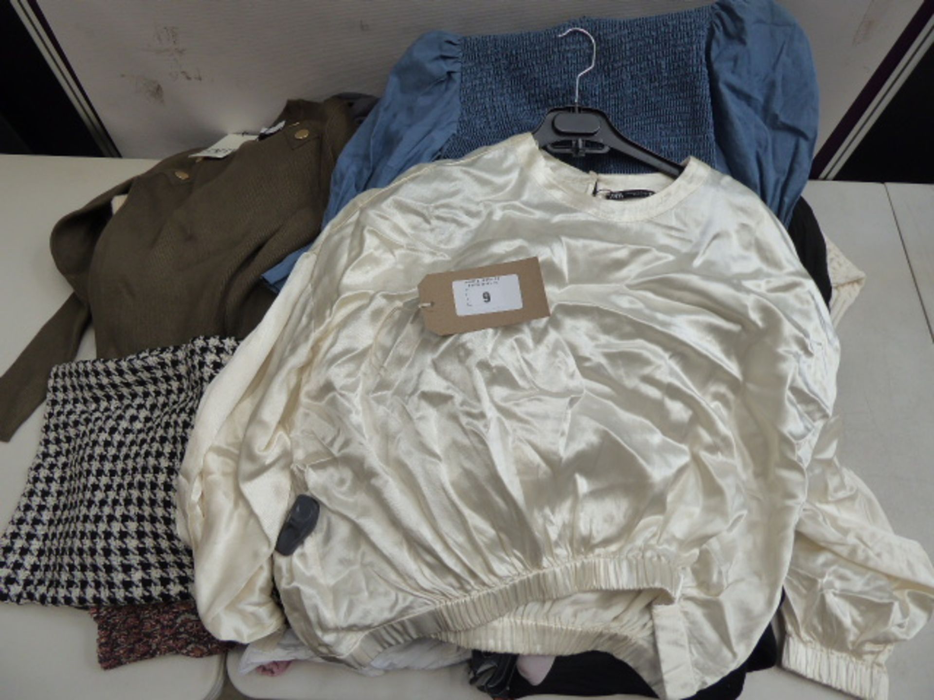 Thirty pieces of Zara clothing in various sizes (some with security tags)