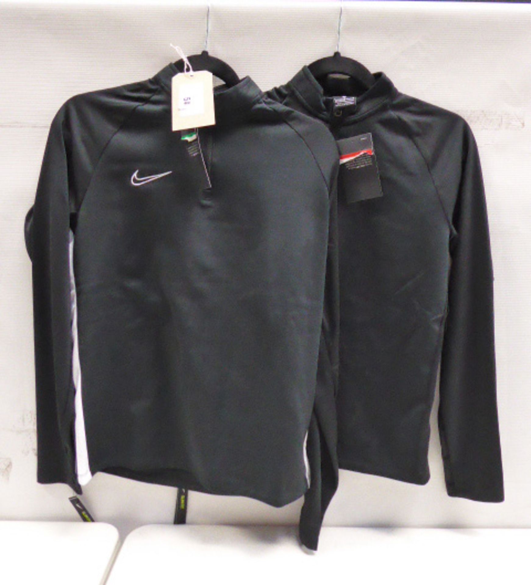 Two Nike black tracksuit tops sizes large and xlarge