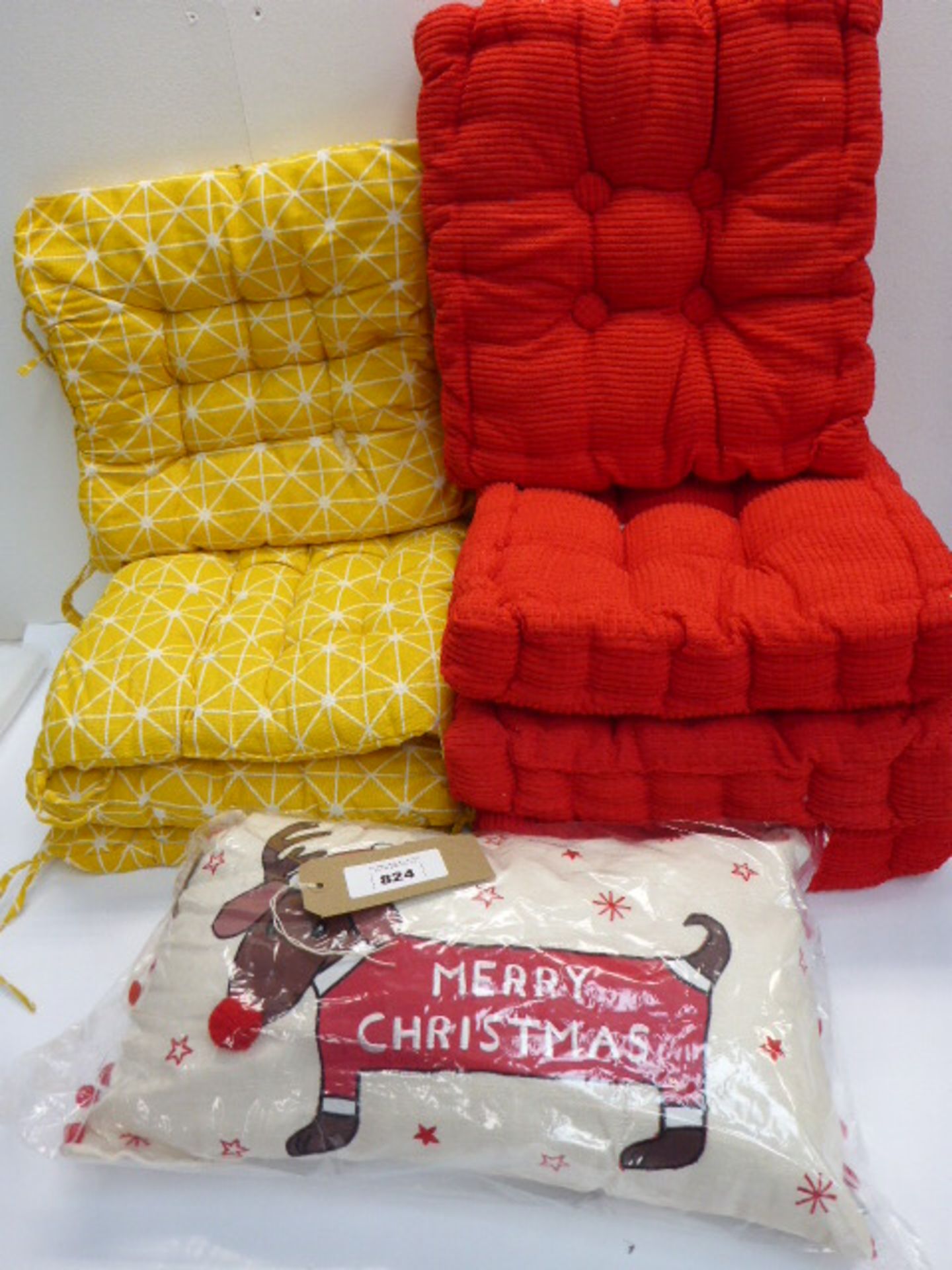 4 yellow & white pattern tie on chair cushions, 4 red dining chair seat cushions and a Merry