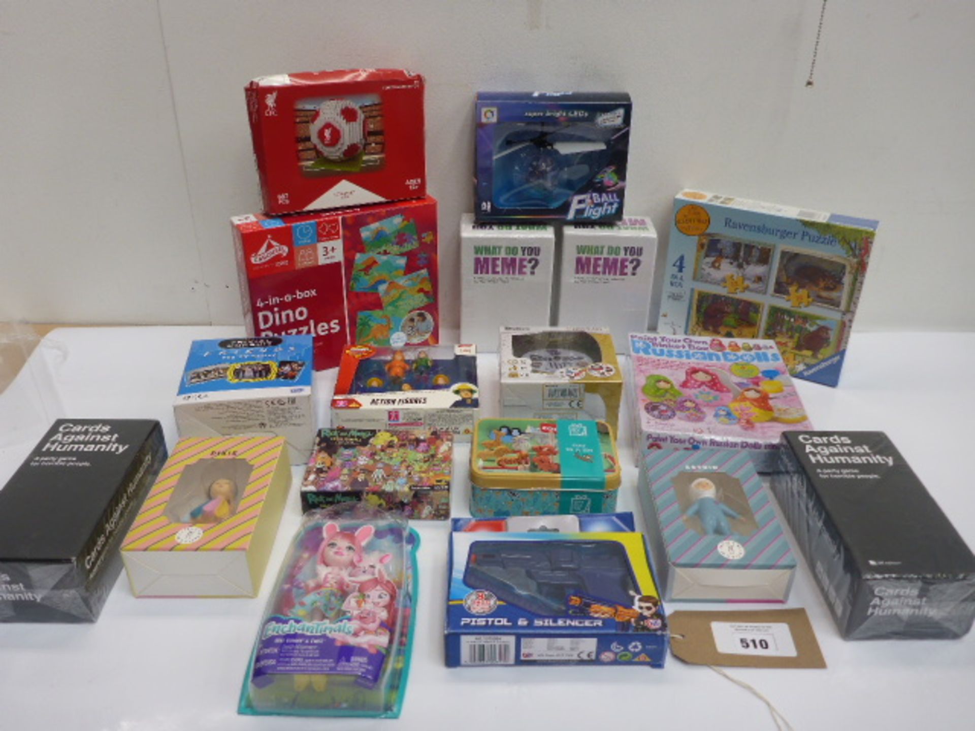 18 toys and games including What Do You Meme?, Cards Against Humanity, Trival Pursuit, jigsaws,