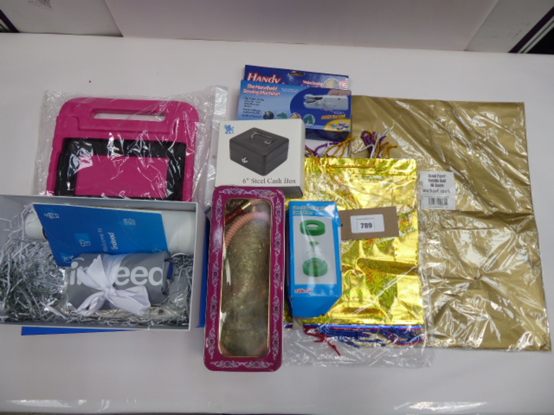 Shisha pipe, metallic gold tissue paper, Indeed welcome pack, steel cash box, handheld sewing