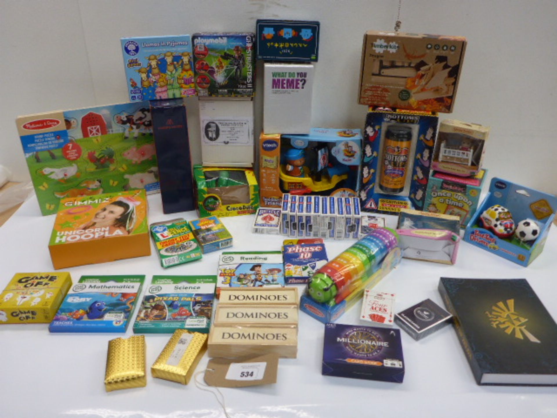 30+ toys, games, packs of cards including What Do You Meme?, Making Moves, Vtech Pirate Ship,