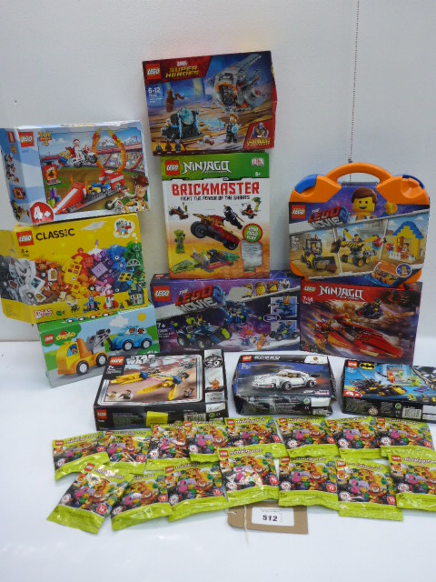 11 Lego construction kits including Speed Champions, Star Wars, Lego Movie, Ninjago (few open) and