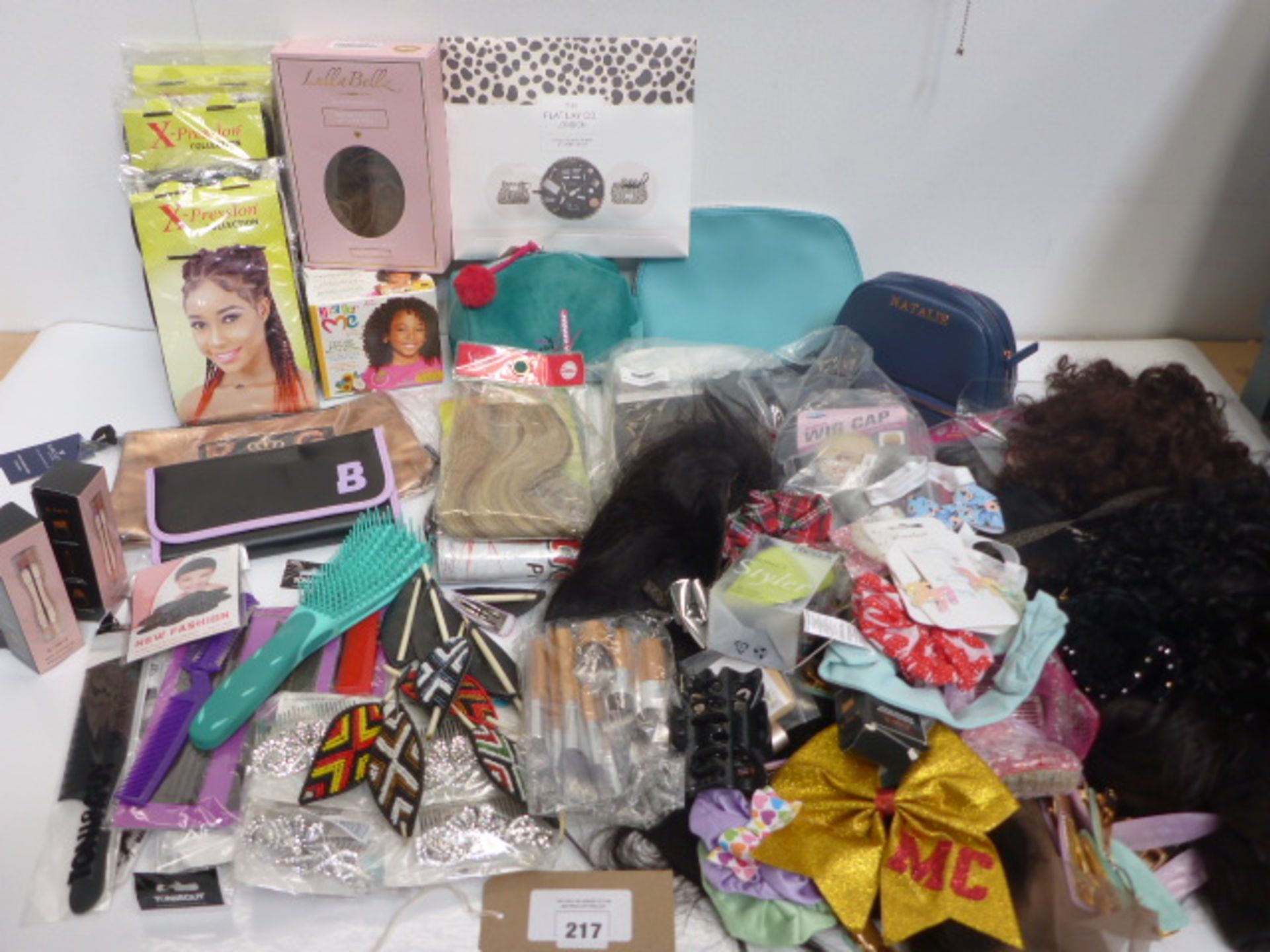 Selection of wigs, hair pieces, hair brushes, decorative hair accessories, makeup bags etc