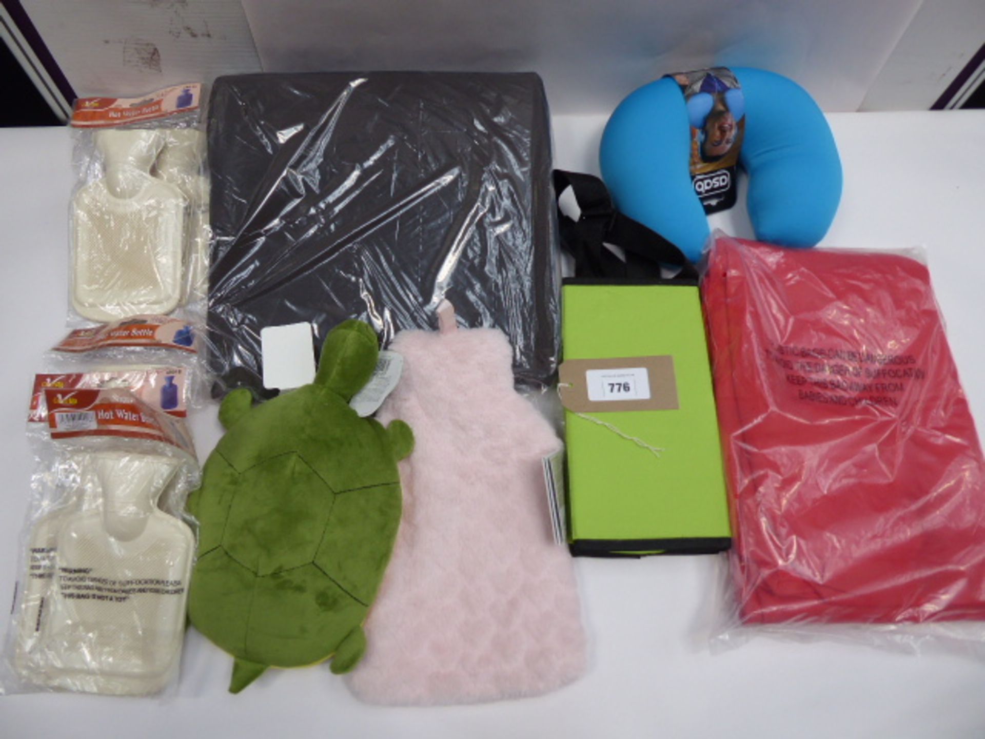 Neck cushion, 'wedge' seat, various hot water bottles and storage bags