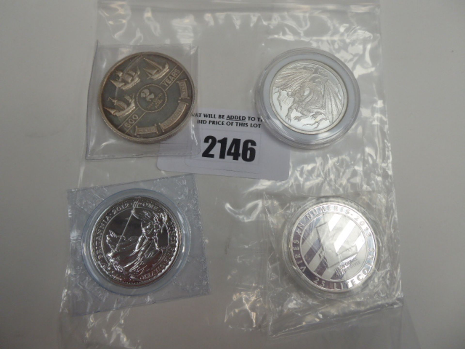 4 silver coins; 2 pound Britannia, World of Dragon, Discovery of Americas and Litecoin