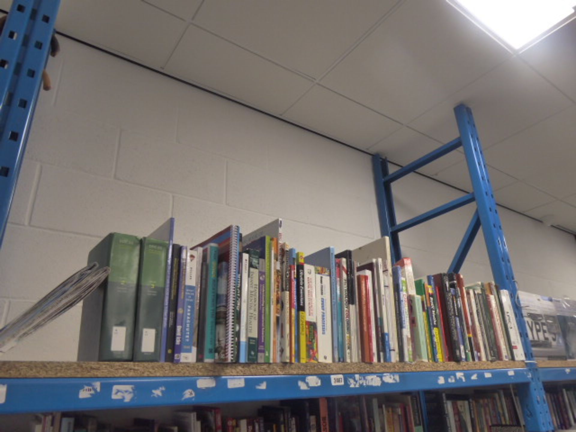 Shelf comprising of reference books, various publishers including Rutlidge, Wiley, Pearson and