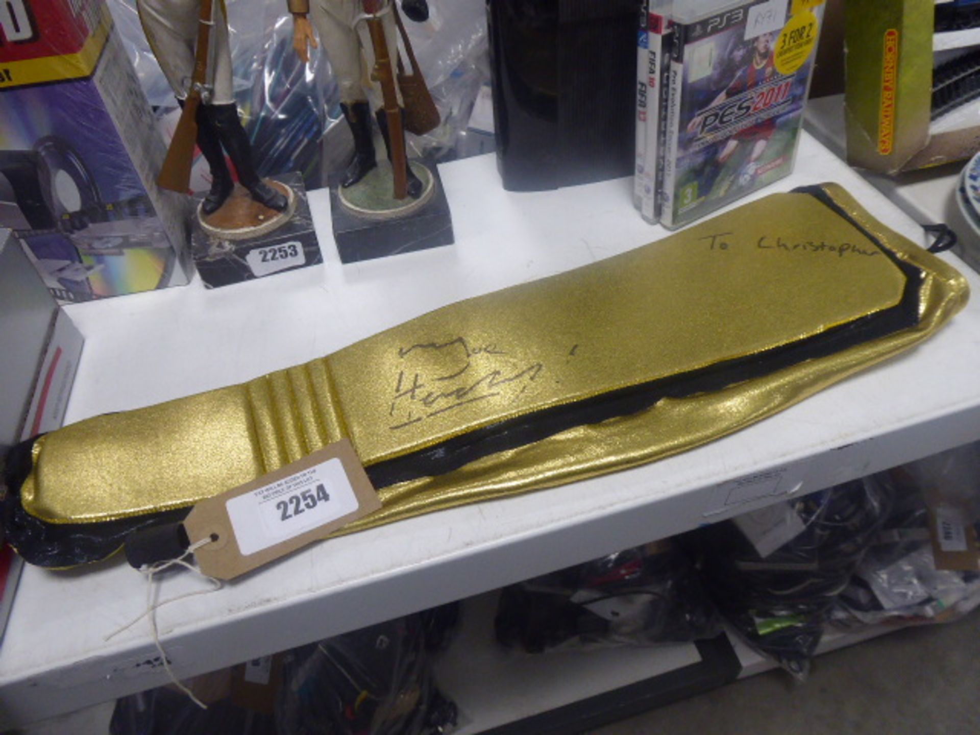 2321 (17/06) - Gold and black signed leg guard personalised to 'Christopher' (No authenticity,