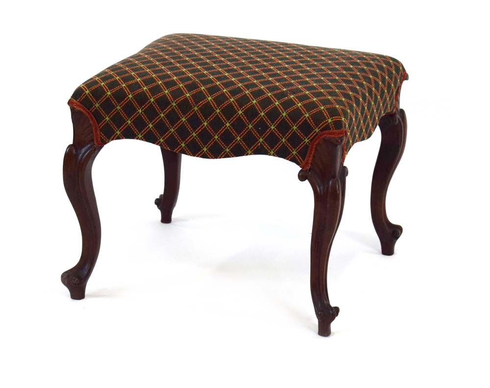 An early Victorian rosewood and upholstered dressing stool on cabriole legs