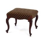An early Victorian rosewood and upholstered dressing stool on cabriole legs
