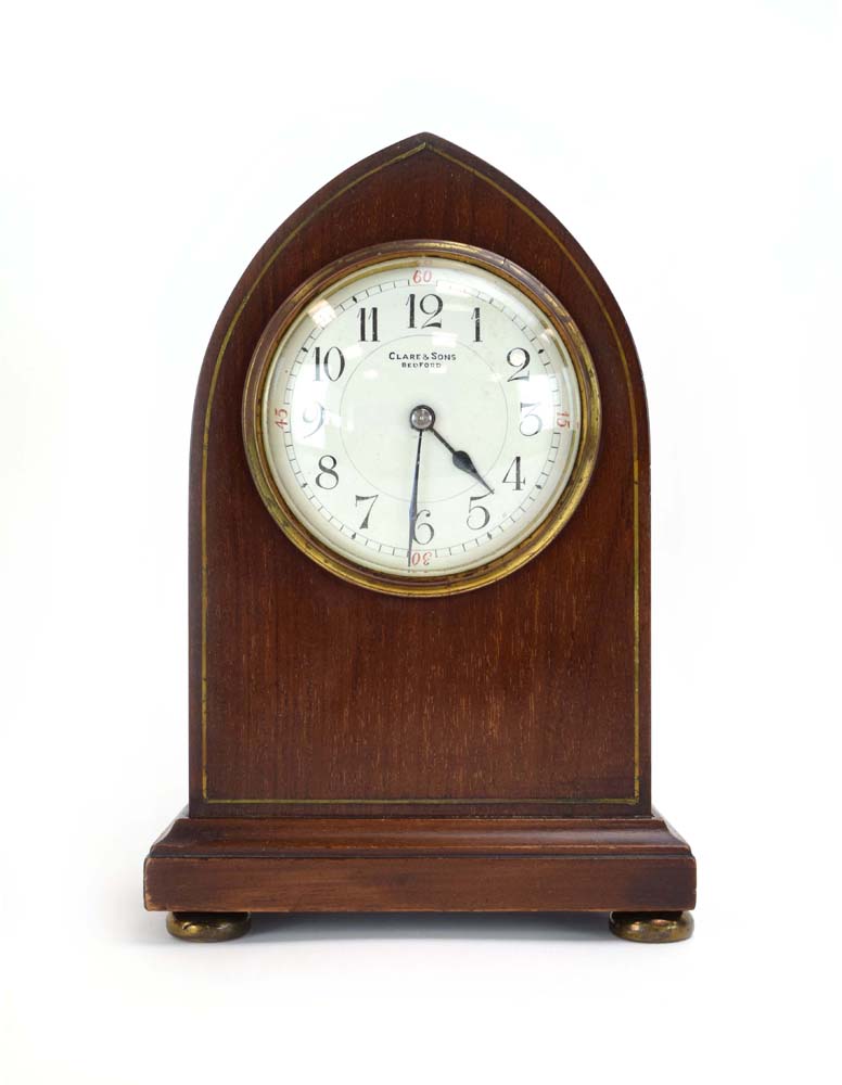 An Edwardian mahogany and strung mantle timepiece,
