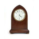 An Edwardian mahogany and strung mantle timepiece,