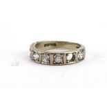 A 14ct yellow gold half eternity ring set seven clear paste in square shaped settings ring size R,