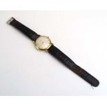 A gentleman's 9ct yellow gold manual wind wristwatch by Garrard,