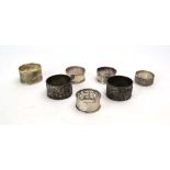 Four silver napkin rings including a Polish example, overall 2.