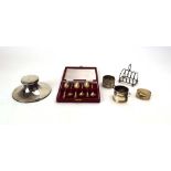 A mixed parcel of silver comprising a cased set of six teaspoons, two napkin rings,