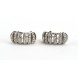 A pair of 18ct white gold ear hoops set six rows of small diamonds in openwork settings, l. 2.