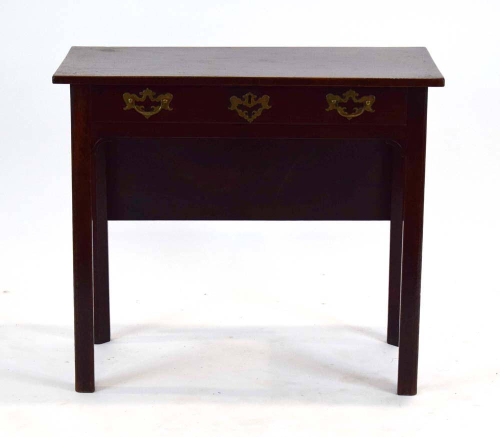 An 18th century Cuban mahogany side/tea table, the folding surface over a single frieze drawer,