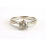 An 18ct white gold ring set brilliant cut diamond in a six claw setting,