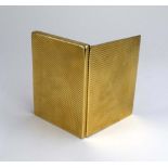 A 9ct yellow gold cigarette case of rectangular form having diagonal ridged decoration, maker JC,