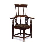An 18th century North of England oak corner chair,