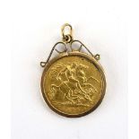 A 9ct yellow gold pendant set an Edwardian half sovereign dated 1909 in a loose mount, overall 5.
