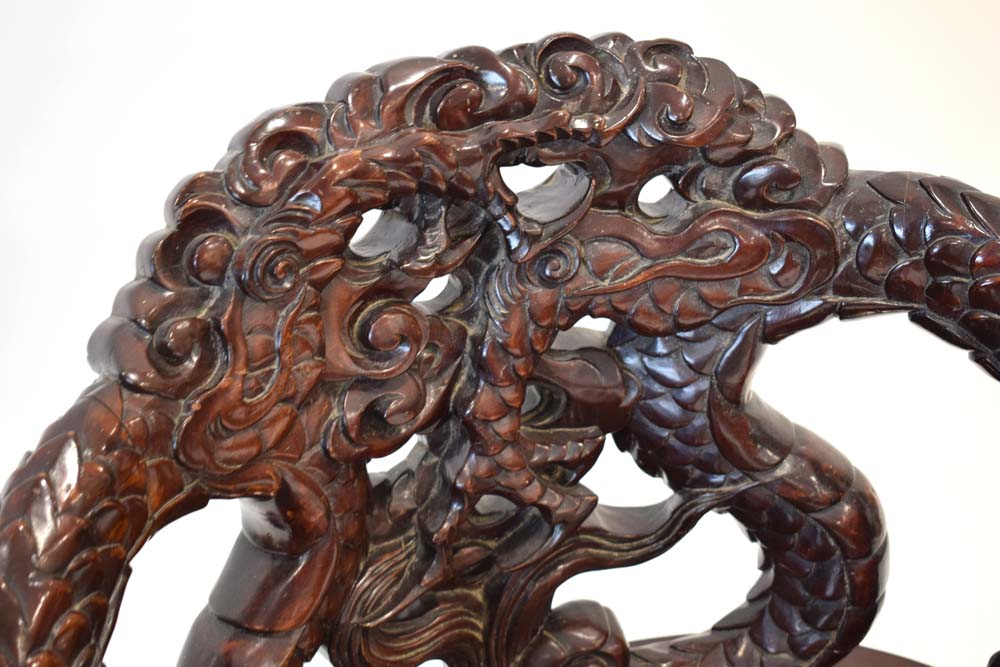 A mid-20th century Oriental hardwood and lacquered chair with intricate dragon carving, - Image 3 of 3