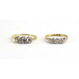 An 18ct yellow gold three stone ring set paste, 1.