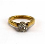 An 18ct yellow gold ring set single brilliant cut diamond in a six claw setting,