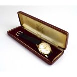 A gentleman's 9ct yellow gold manual wind wristwatch by Garrard,