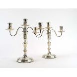 A pair of silver three branch candelabrum of traditional form, maker DMS, London 1977, h.