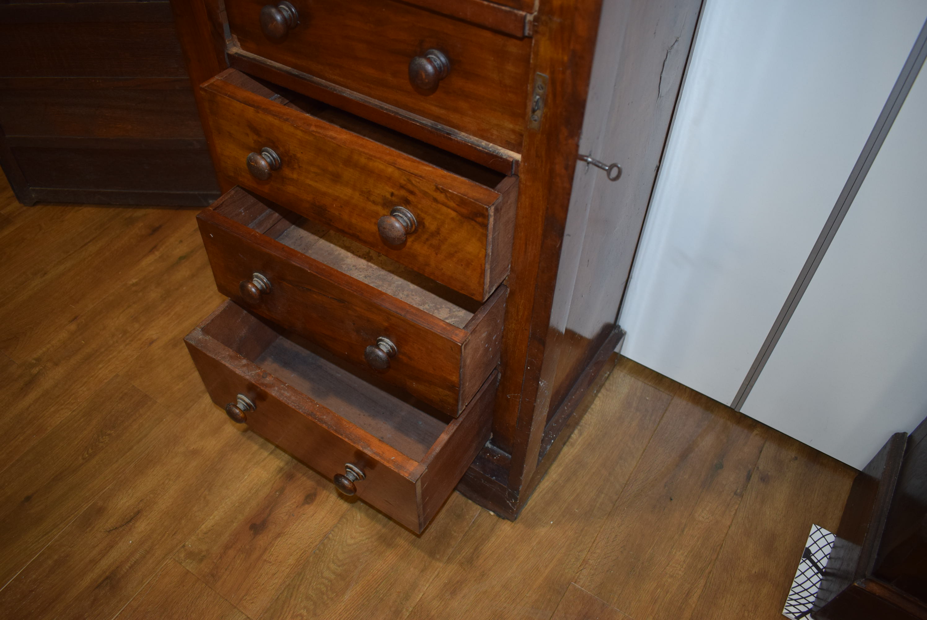 A Victorian walnut 'Wellington' chest, the seven graduated drawers flanked by a pair of columns, - Image 21 of 23