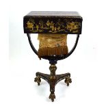 A 19th century European black lacquered work table decorated in the chinoiserie manner,