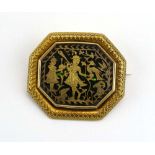 A 19th century Indian Pertabgarh yellow metal brooch of octagonal form centrally depicting a male