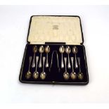 A cased set of twelve silver teaspoons and a pair of matching sugar nips, maker TB&S,