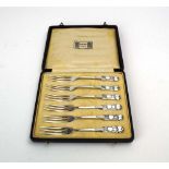 A cased set of six silver cake forks in the Art Nouveau manner, Archibald Knox for Liberty & Co.