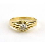 A yellow metal ring set old cut diamond in an eight claw setting, stone approximately 0.