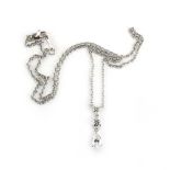 An 18ct white gold fine chainlink necklace suspending a pendant set two graduated brilliant cut