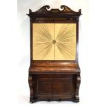 A Regency rosewood and brass mounted secretaire cabinet, later converted from a piano by Henderson,