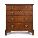 A 19th century oak chest of two short and three long graduated drawers on shaped bracket feet, w.