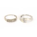 A 9ct white gold crossover ring set small diamonds and a 14ct white gold ring set six graduated