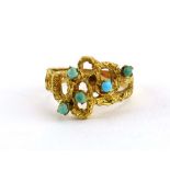 A 1970's 18ct yellow gold bark design ring of openwork design set five small turquoise, ring size O,