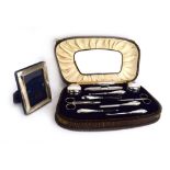 A cased silver manicure set, maker C&N, Birmingham 1928,