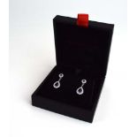 A pair of 18ct white gold ear pendants,