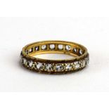 A 9ct yellow gold full eternity ring set paste, ring size P 1/2, 2.